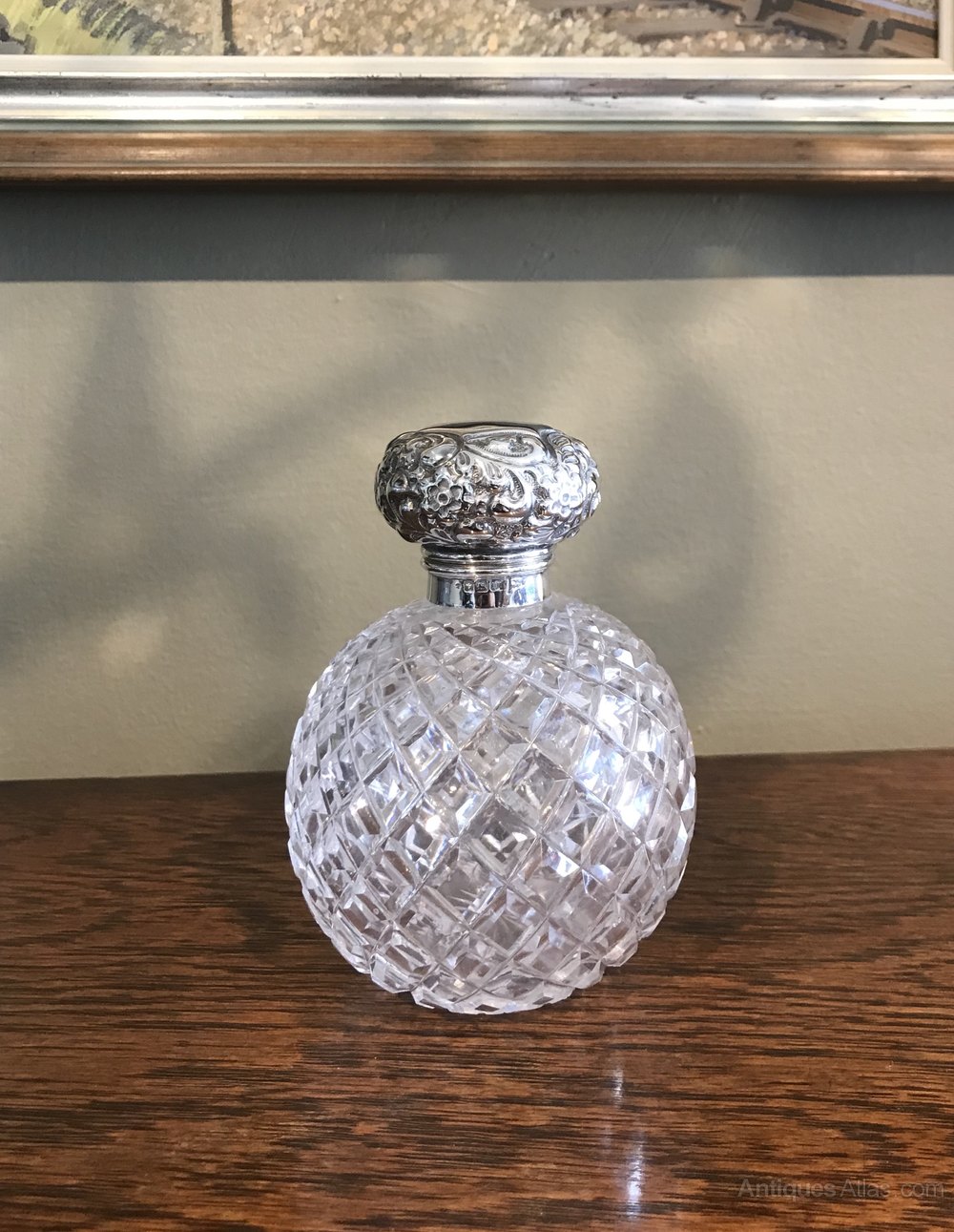 Glass Scent Perfume Bottle A circular glass scent bottle with a
