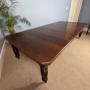 A Walnut, late Victorian extending dining table.
