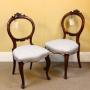 A Pair of Walnut Balloon Back “Bedroom” Chairs