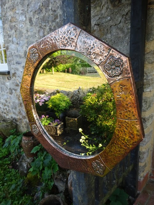 Arts & Crafts octagonal copper mirror with roses