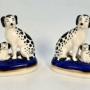 A pair of miniature porcelain dog figures C1890