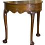 A demi lune mahogany George II style side table
