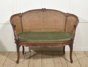 Louis XV–Style Carved Walnut Caned Settee
