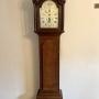 Antique George III oak arched dial long case clock