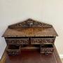 Carved oak writing desk