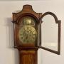 Oak and brass arch face long case clock
