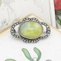 Green stone & marcasite brooch marked Silver