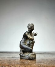 A Small 17th Century Bronze Crouching Venus.