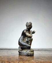 A Small 17th Century Bronze Crouching Venus.